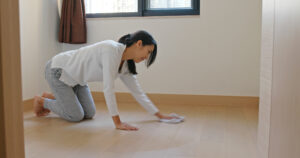 Asian Woman cleans the floor at home preparing for lunar new year